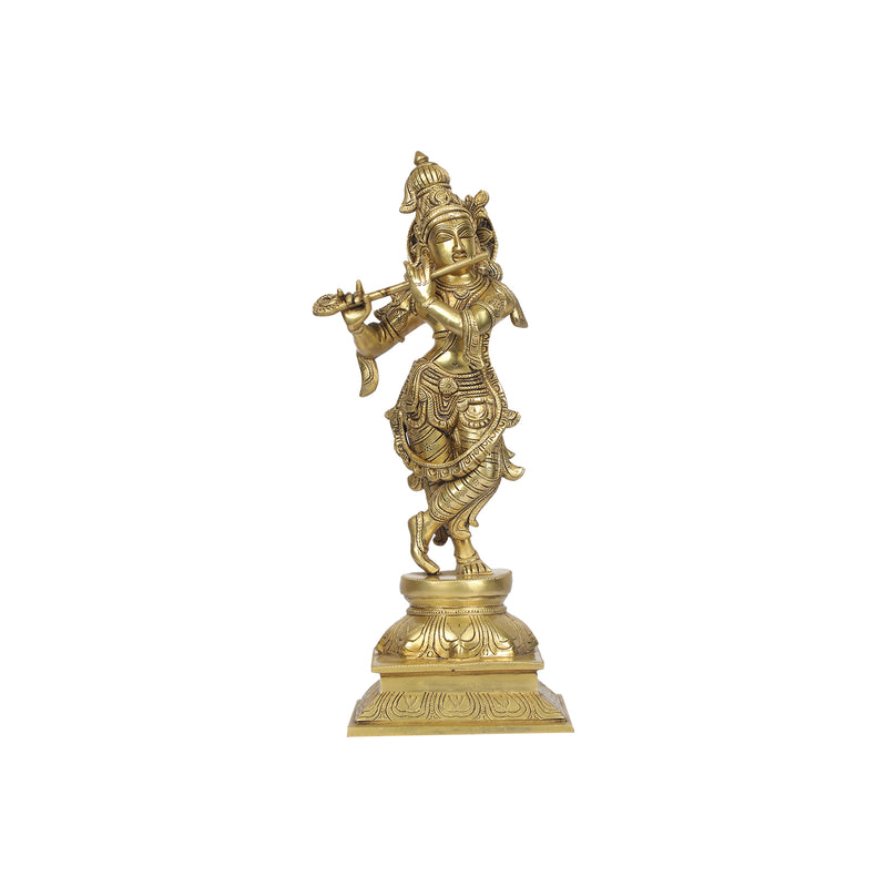 brass Krishna statue standing on a lotus base