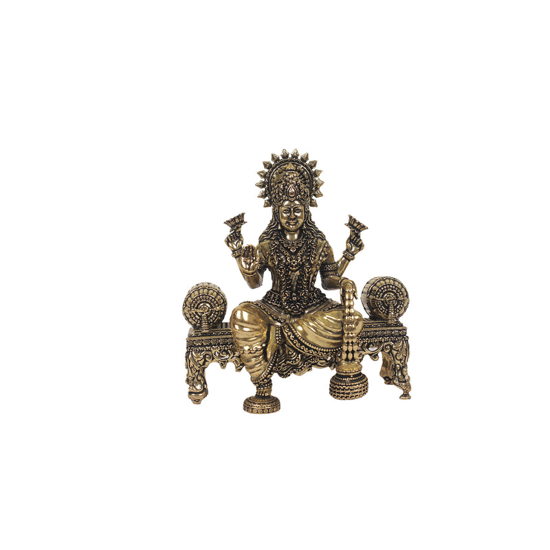 Brass  laskhmi sitting on sofa