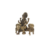 Brass  laskhmi sitting on sofa