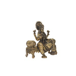Brass  laskhmi sitting on sofa