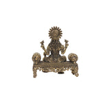Brass  laskhmi sitting on sofa
