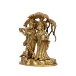Brass Radha Krishna standing under Tree