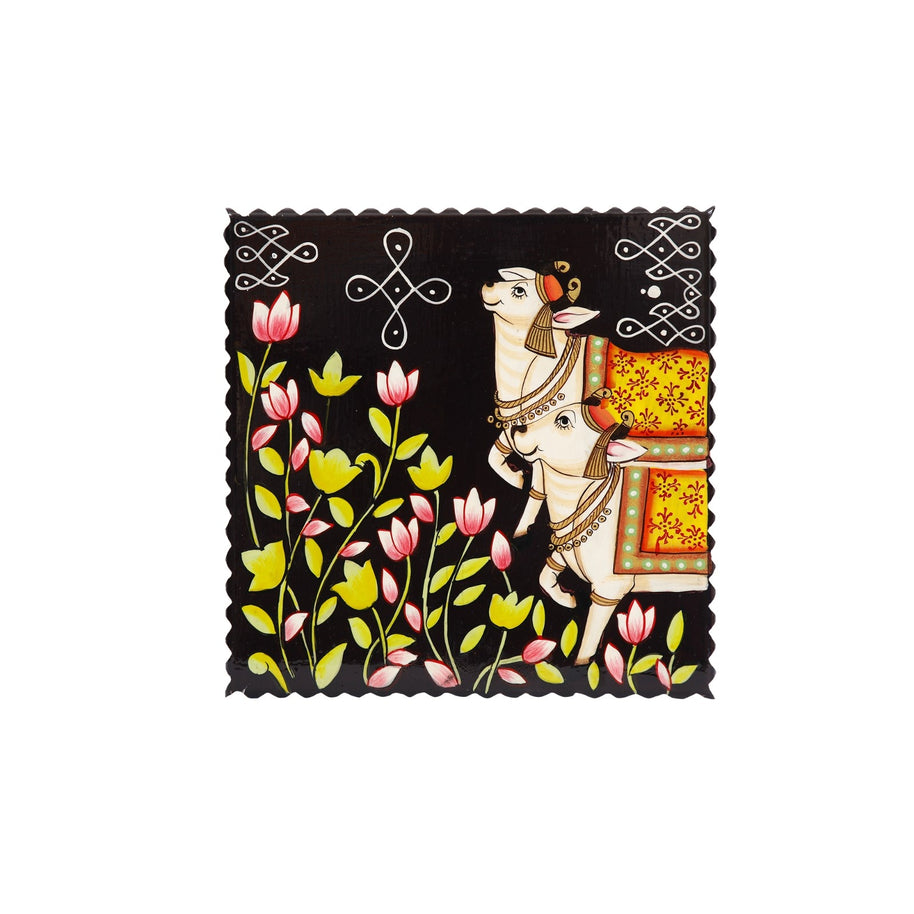Wooden Cow with Rangoli Chowki