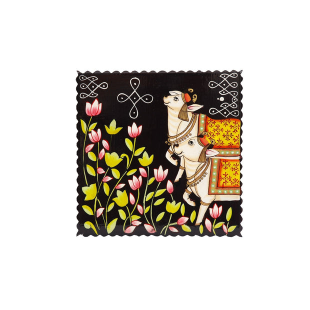 Wooden Cow with Rangoli Chowki